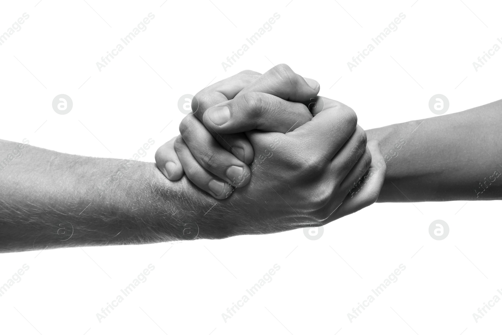 Image of Help and support. People holding hands on white background, closeup. Toned in black and white