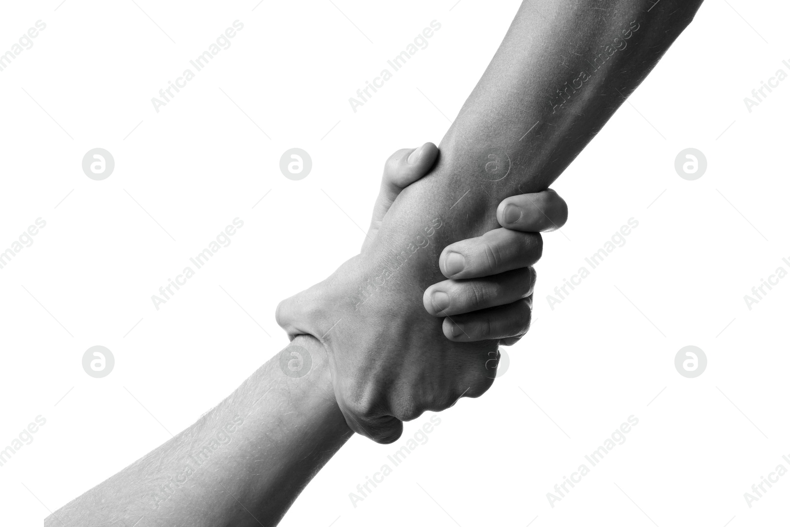 Image of Help and support. People holding hands on white background, closeup. Toned in black and white