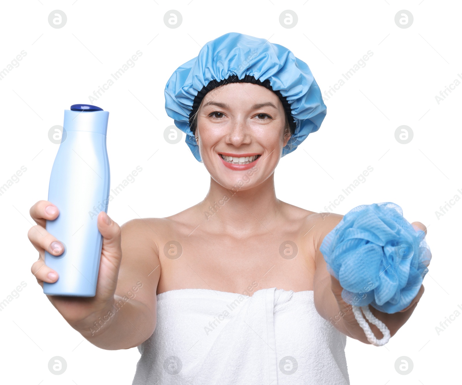 Photo of Woman with blue shower cap, mesh sponge and shampoo on white background