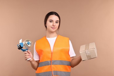 Photo of Girl in uniform with adhesive tape and parcel on pale brown background. Work for teenagers