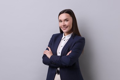 Photo of Portrait of businesswoman on light grey background, space for text