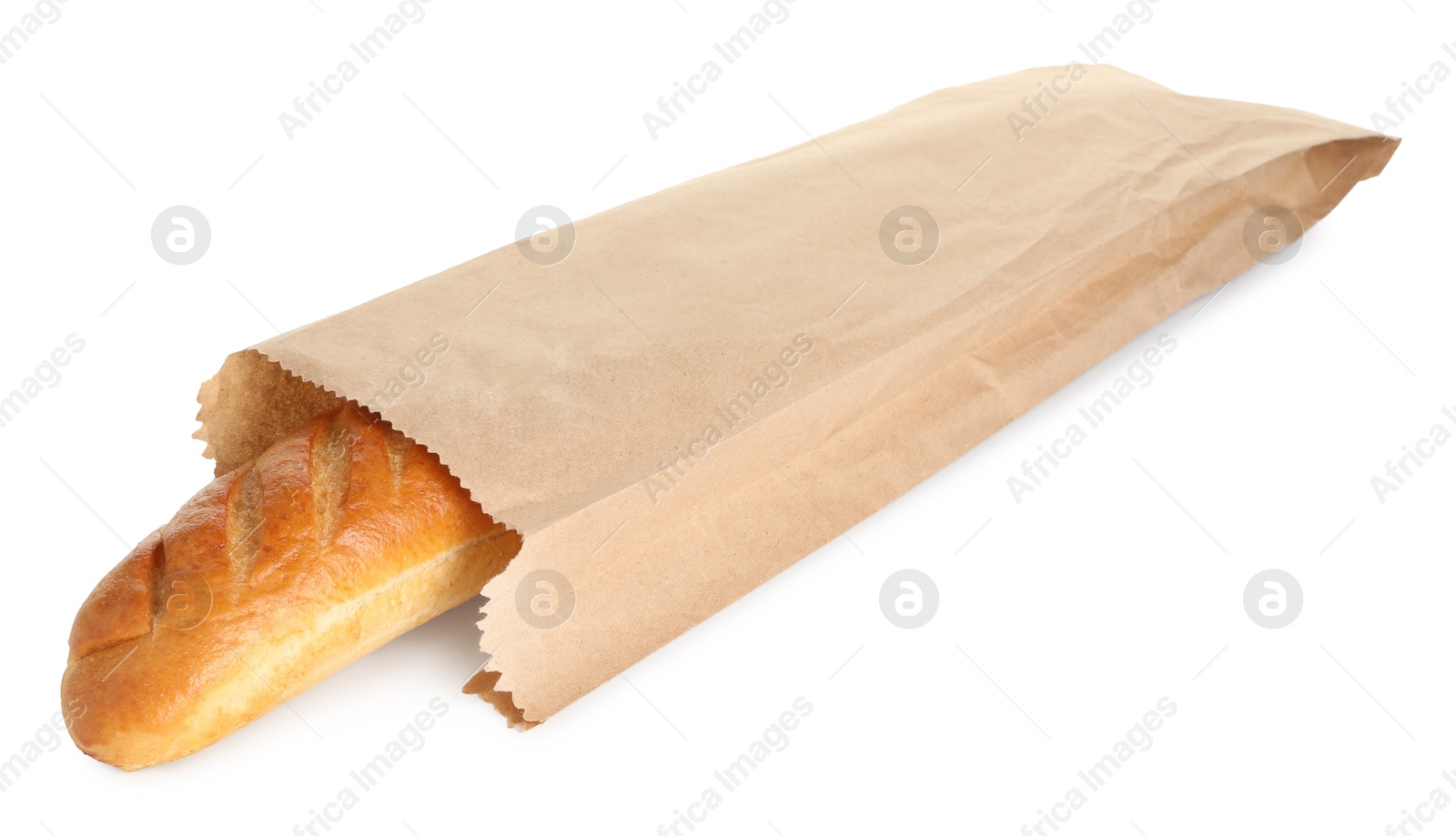 Photo of Freshly baked baguette in paper bag isolated on white