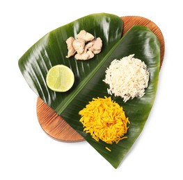 Photo of Cut banana leaf with different food isolated on white, top view. Healthy eco serving