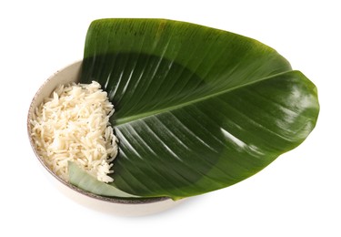 Photo of Cut banana leaf with rice in bowl isolated on white. Healthy eco serving