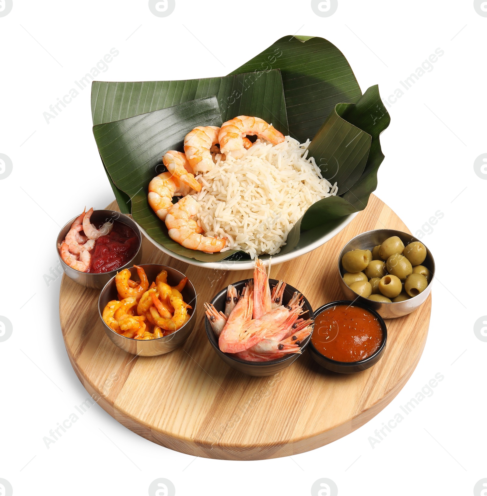 Photo of Cut banana leaves with different food and sauce isolated on white