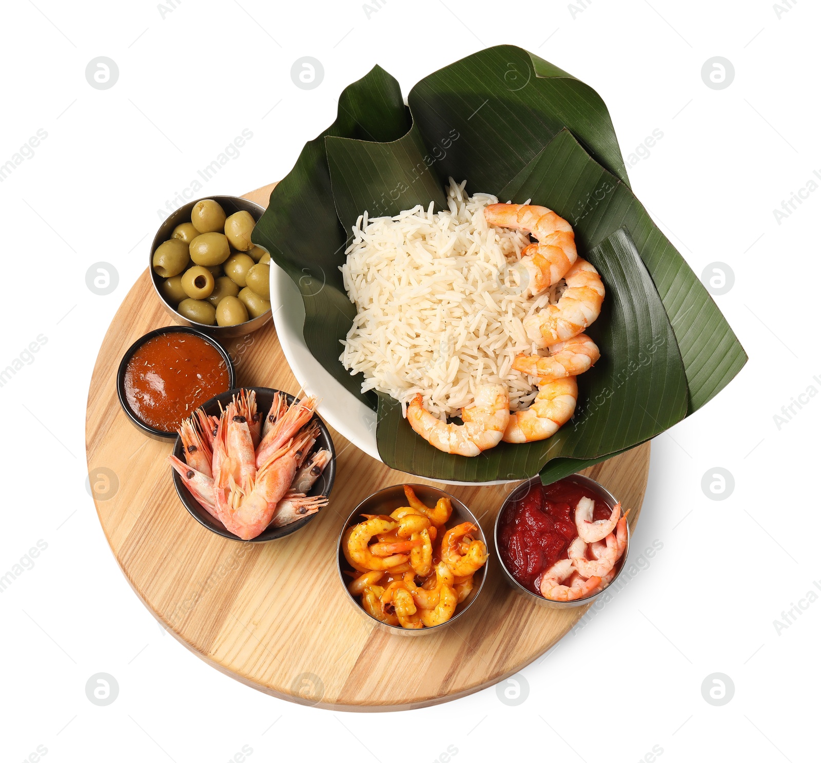 Photo of Cut banana leaves with different food and sauce isolated on white, top view