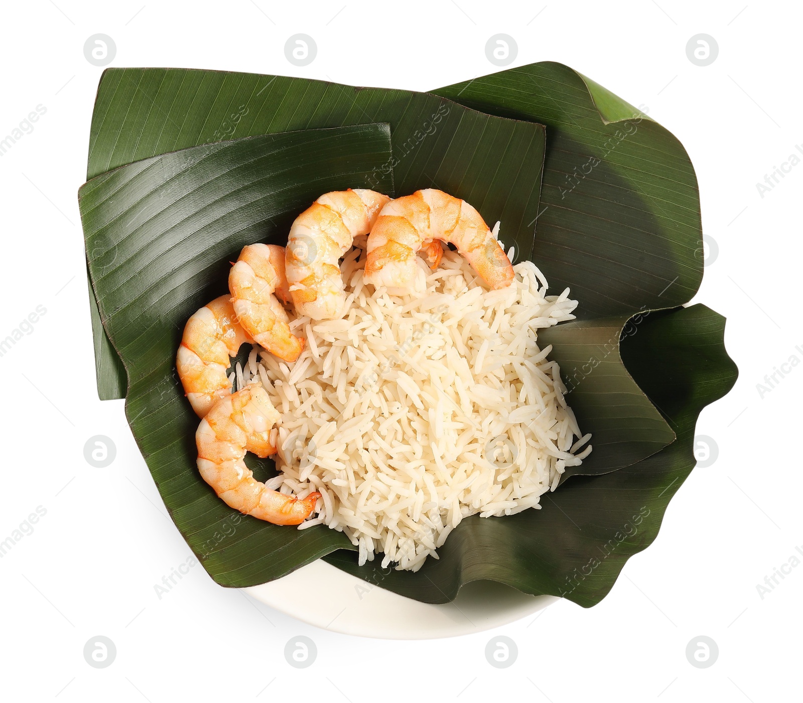 Photo of Cut banana leaves with rice and shrimps in bowl isolated on white, top view