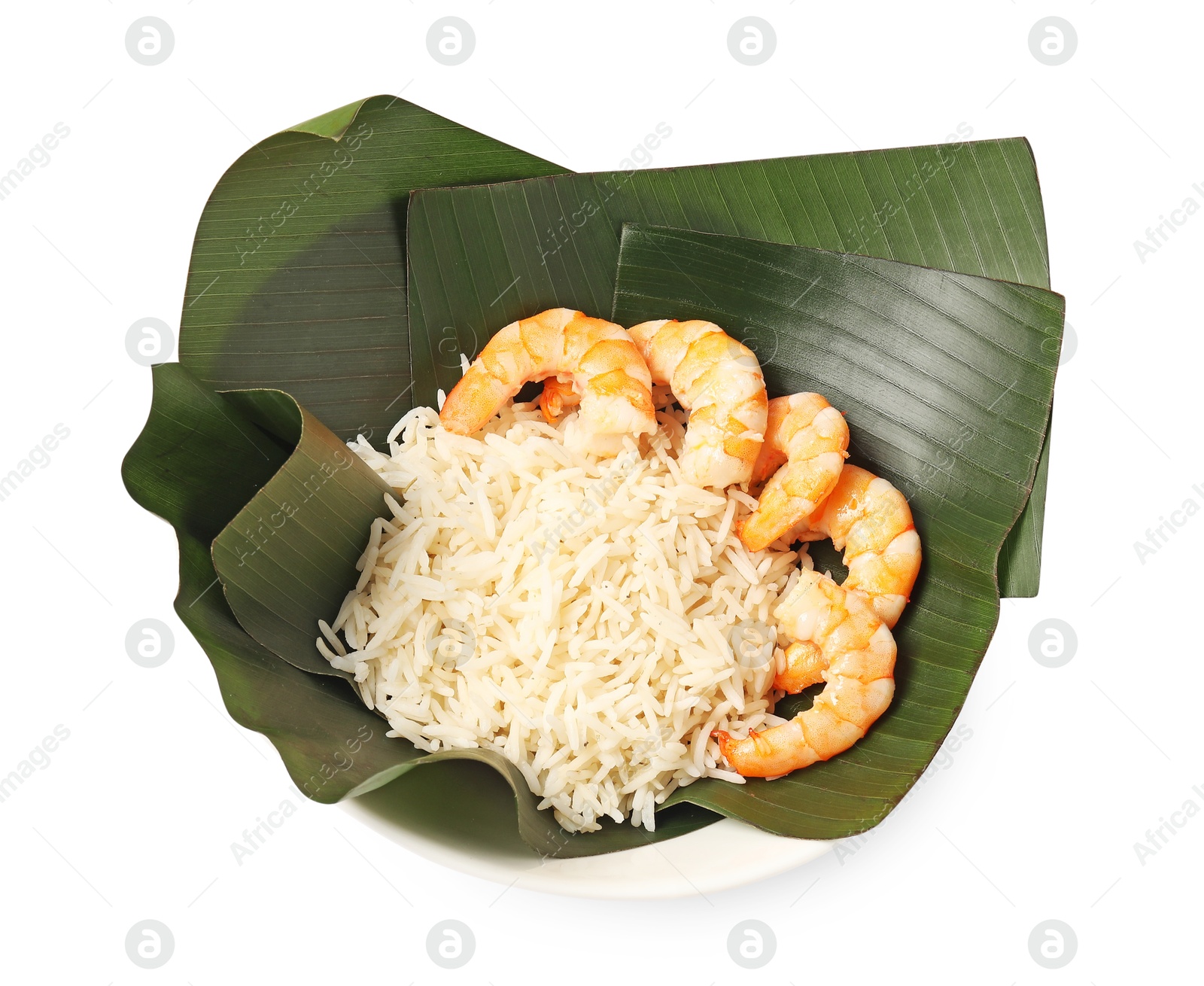 Photo of Cut banana leaves with rice and shrimps in bowl isolated on white, above view