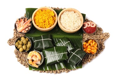 Photo of Cut banana leaves with different food isolated on white, top view. Healthy eco serving