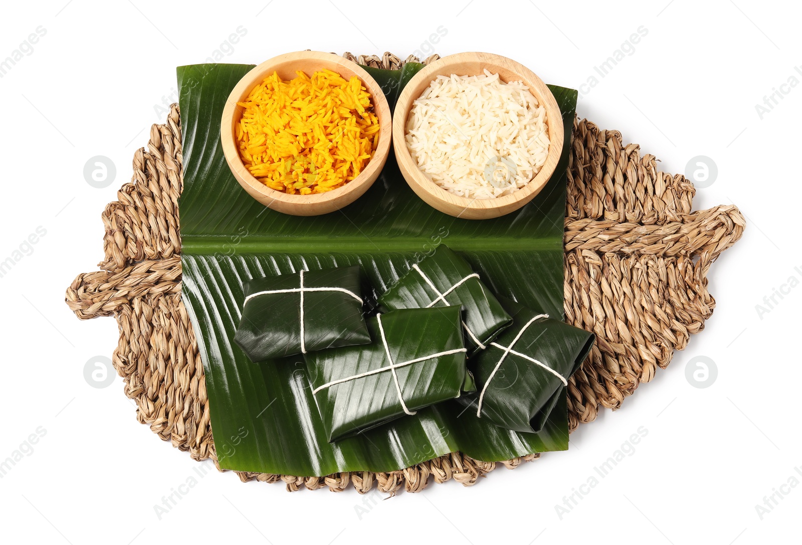 Photo of Cut banana leaves with rice isolated on white, top view. Healthy eco serving