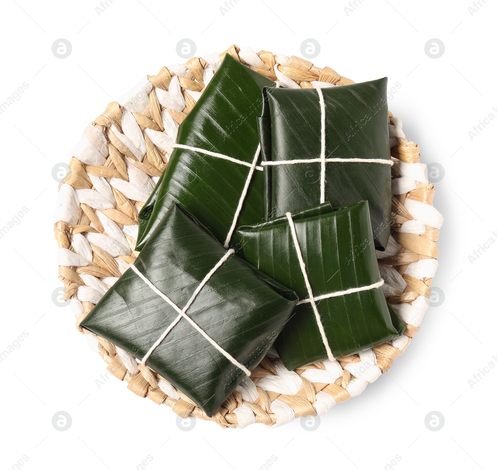 Photo of Cut banana leaves with food isolated on white, top view. Healthy eco serving