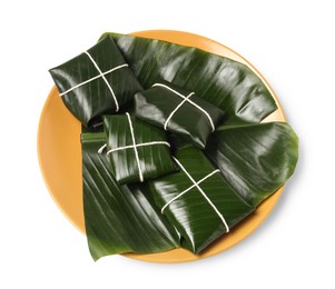 Photo of Cut banana leaves with food isolated on white, above view. Healthy eco serving