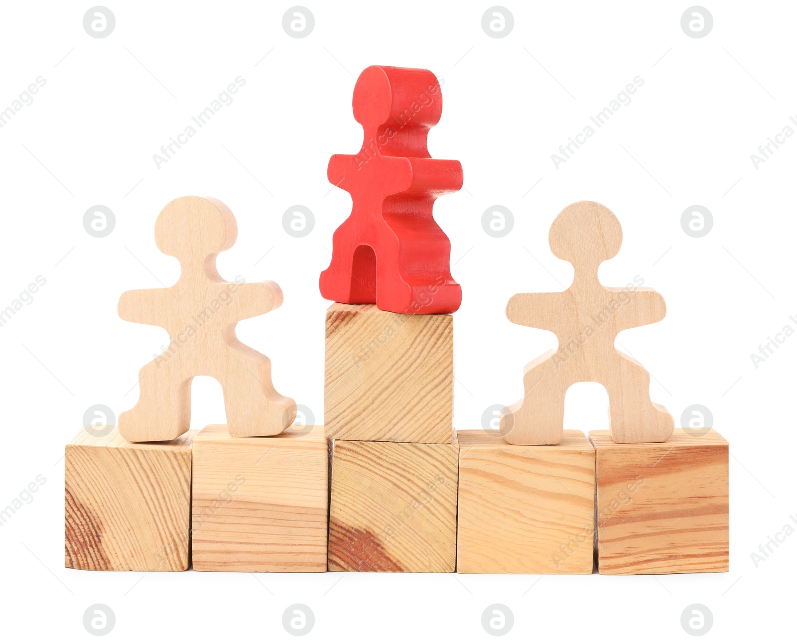 Photo of Human figures on wooden blocks, red one on top against white background. Competition concept