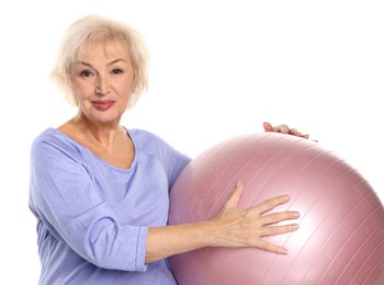 Photo of Senior woman with fitness ball on white background