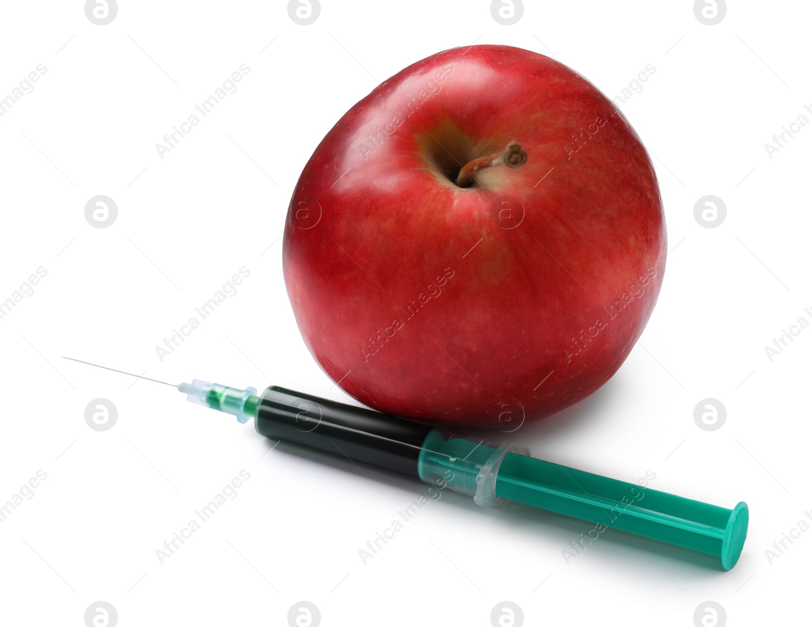 Photo of GMO concept. Red apple and syringe isolated on white