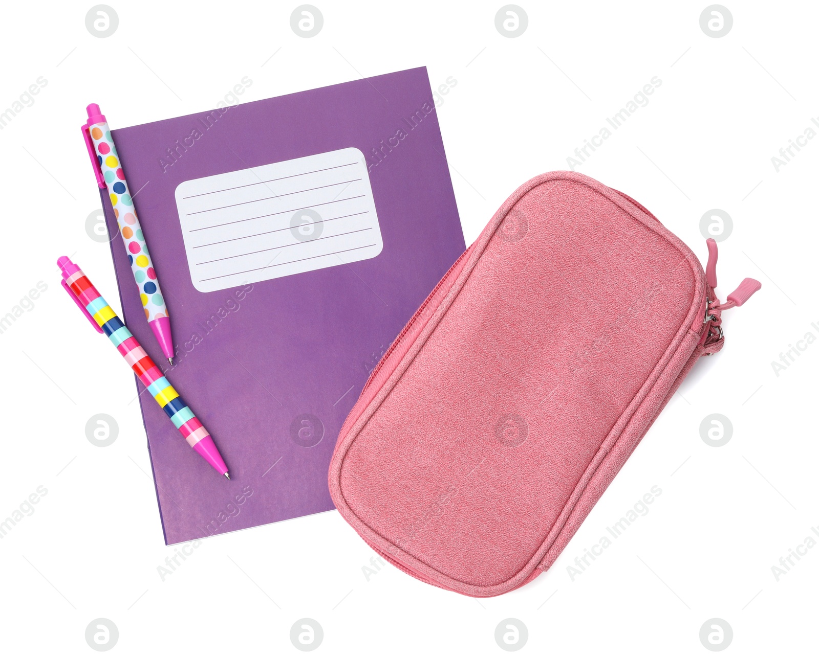 Photo of Copybook, pencil case and pens isolated on white, top view. School stationery