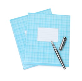 Photo of Copybooks and pen isolated on white, top view. School stationery