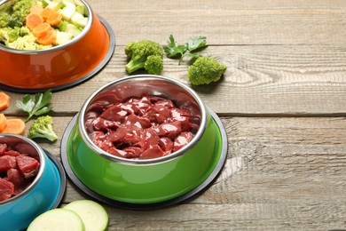 Photo of Pet food. Natural products on wooden table, closeup