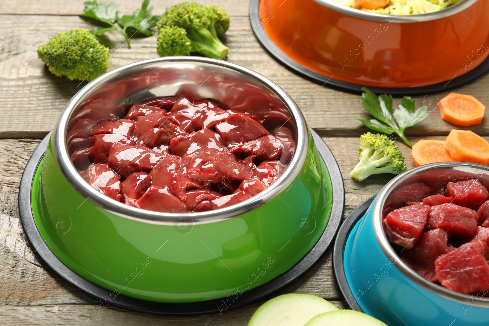 Photo of Pet food. Natural products on wooden table, closeup