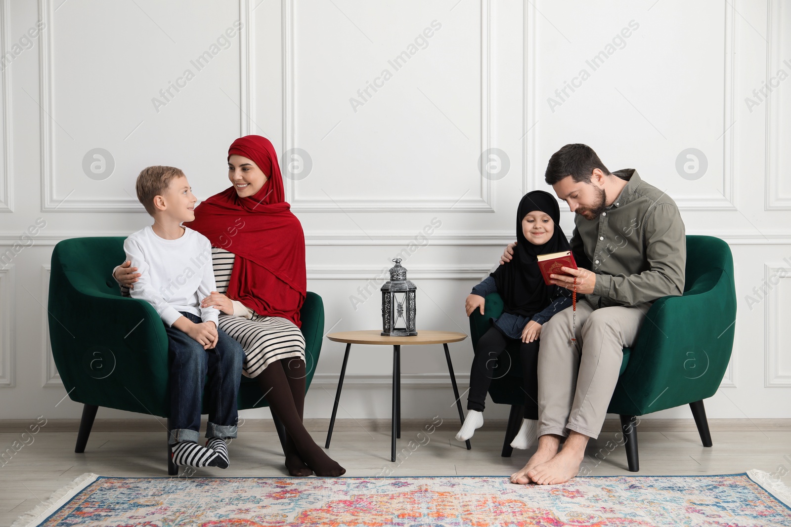 Photo of Happy Muslim family spending time together at home