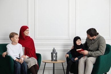 Photo of Happy Muslim family spending time together at home