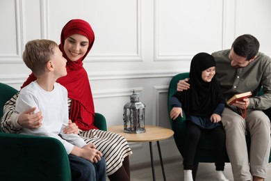 Photo of Happy Muslim family spending time together at home