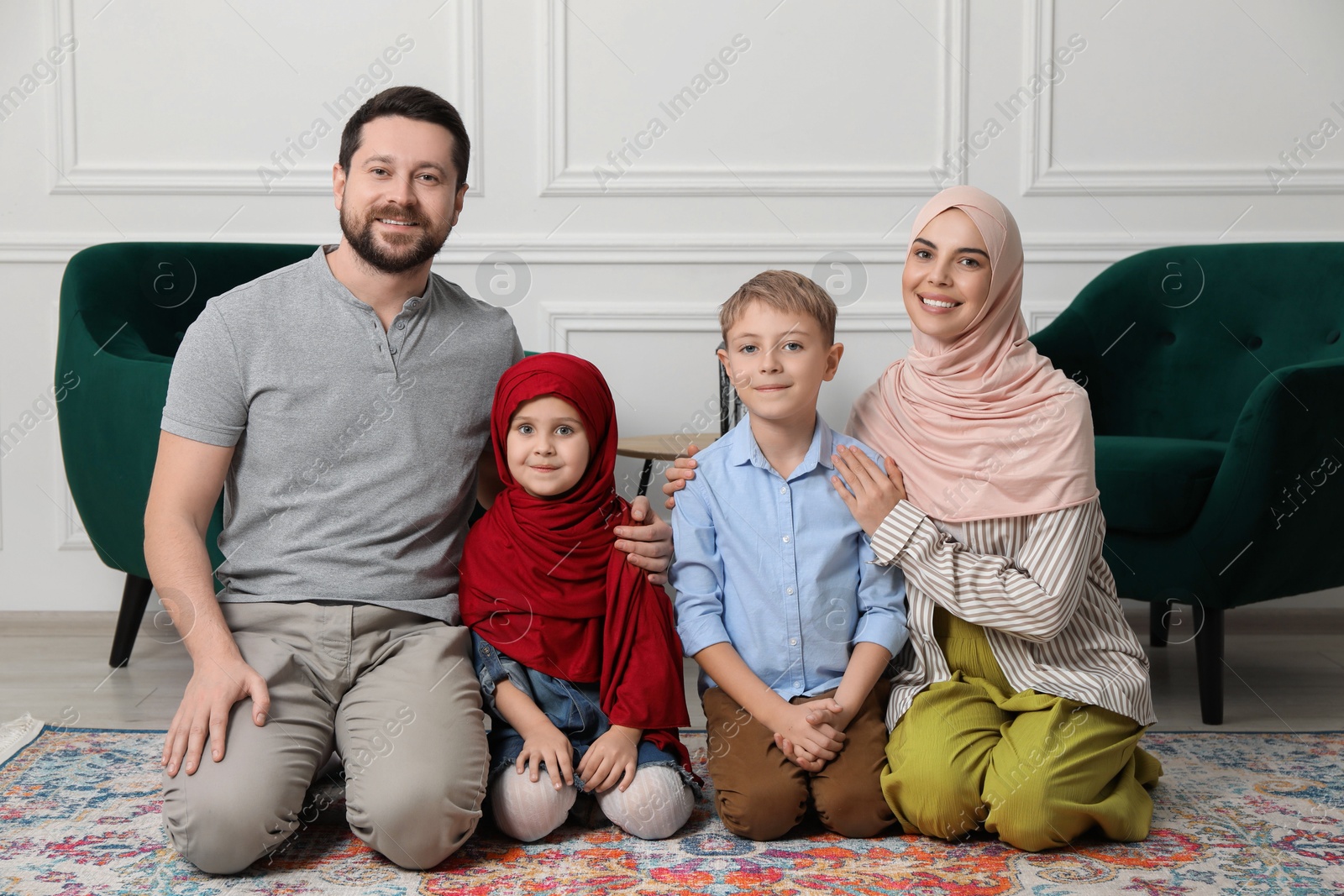 Photo of Happy Muslim family spending time together at home