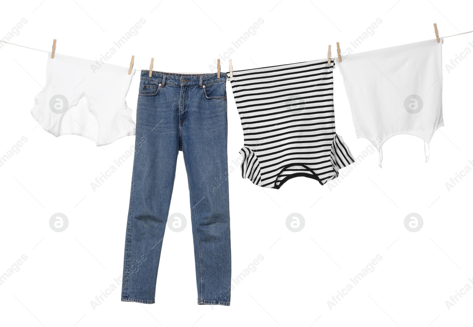 Photo of Different clothes drying on laundry line against white background