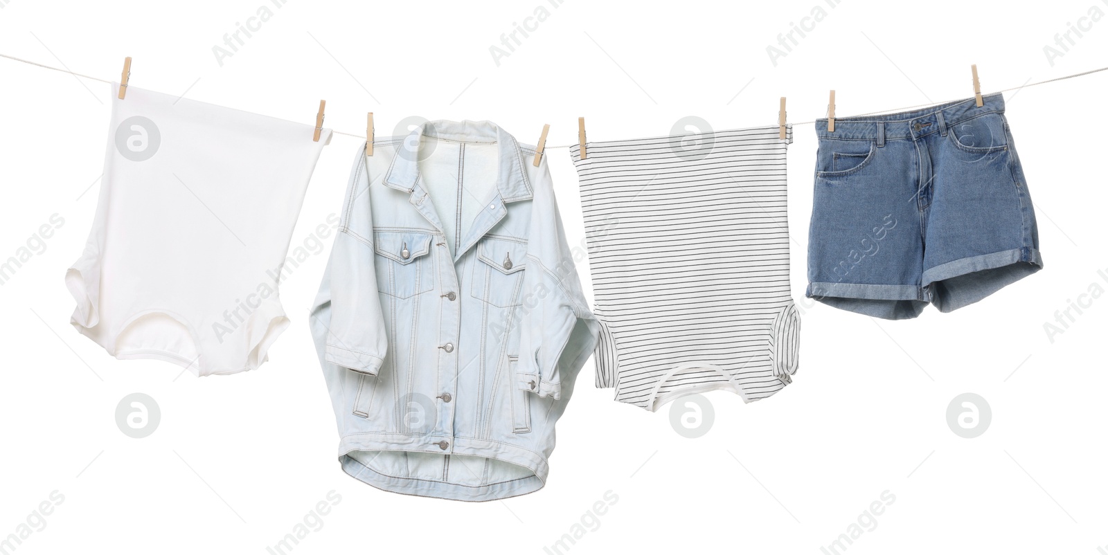 Photo of Different clothes drying on laundry line against white background