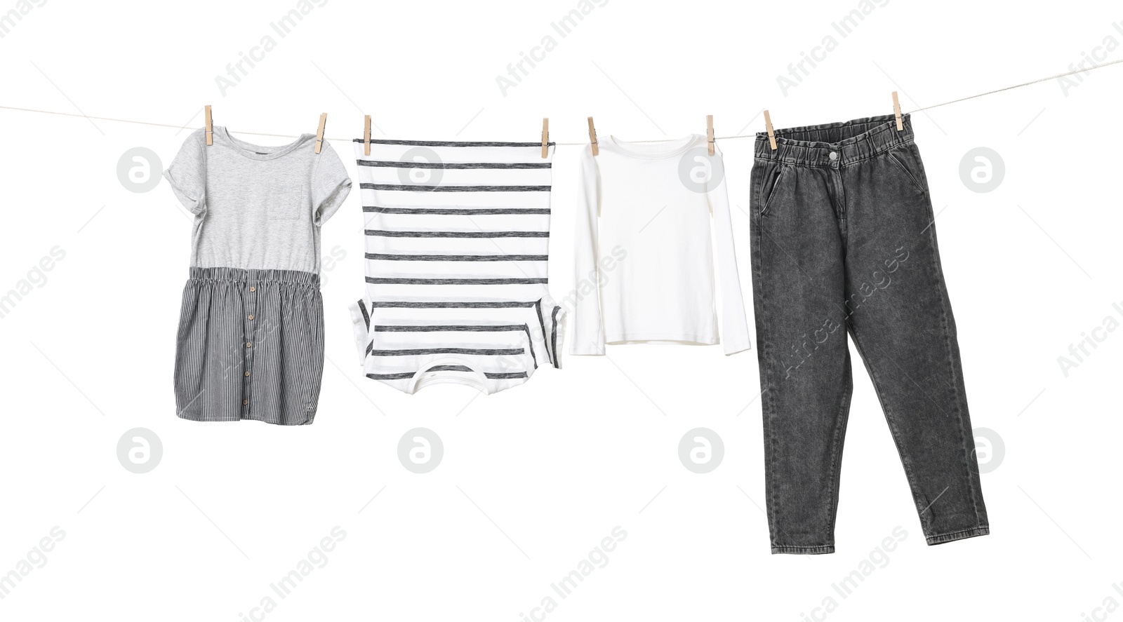 Photo of Different clothes drying on laundry line against white background