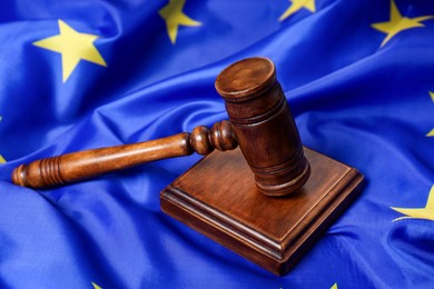 Photo of Judge's gavel on flag of European Union, closeup