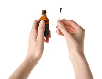 Photo of Woman with bottle of topical iodine and cotton swab on white background, closeup