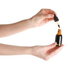 Photo of Woman with bottle of topical iodine on white background, closeup