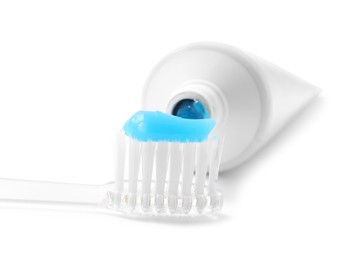 Photo of Toothbrush with toothpaste and tube isolated on white