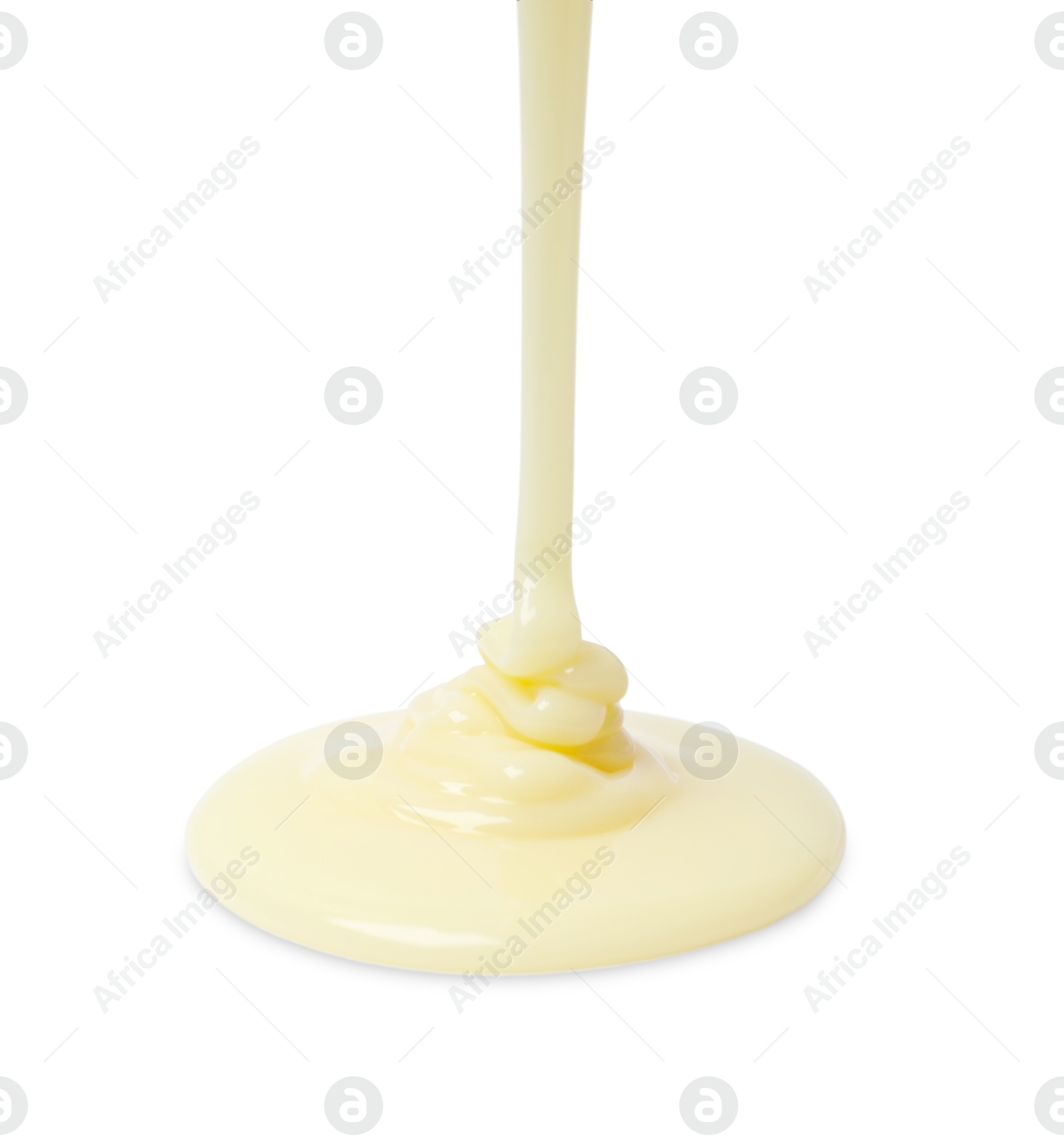 Photo of Pouring delicious condensed milk isolated on white