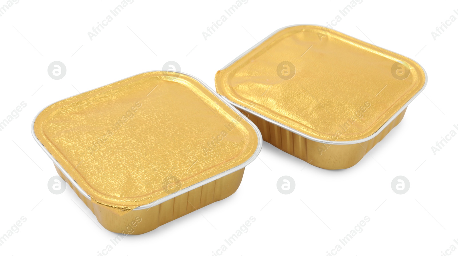 Photo of Pet food in foil containers isolated on white