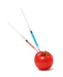 Photo of GMO concept. Fresh tomato and syringes isolated on white