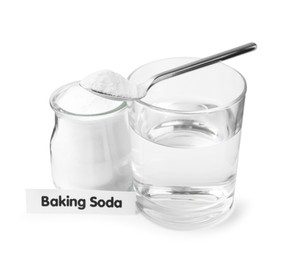 Glass of water and baking soda on white background