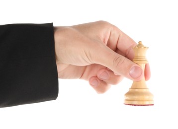 Photo of Man holding chess queen on white background, closeup. Competition concept