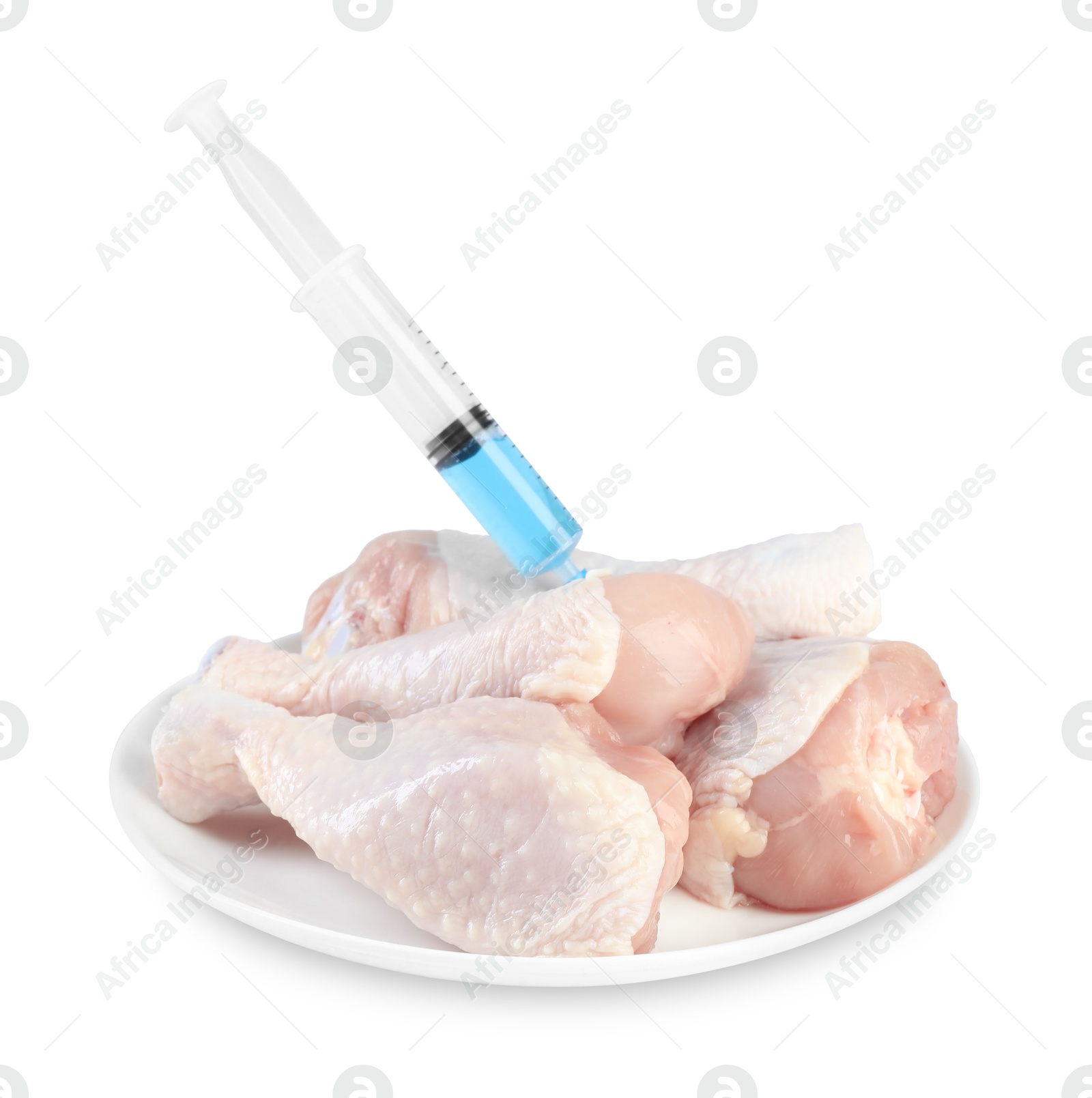 Photo of GMO concept. Chicken drumsticks and syringe isolated on white