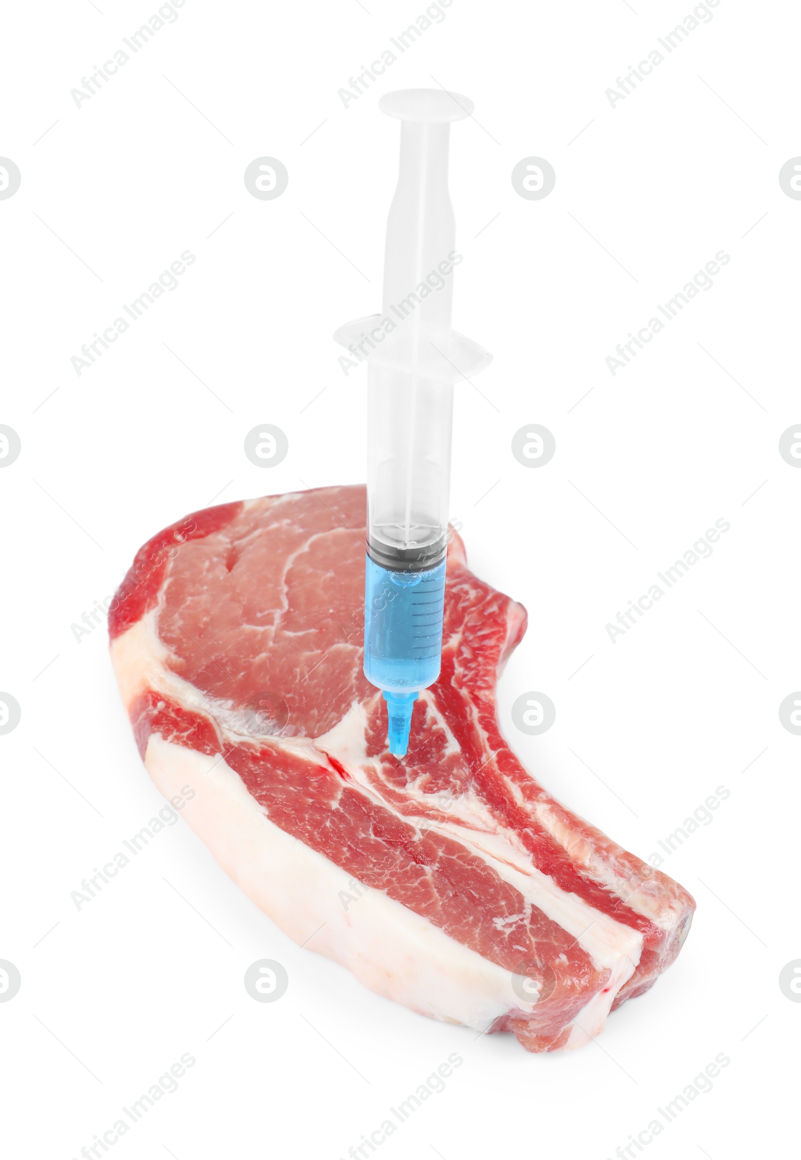 Photo of GMO concept. Pork steak and syringe isolated on white