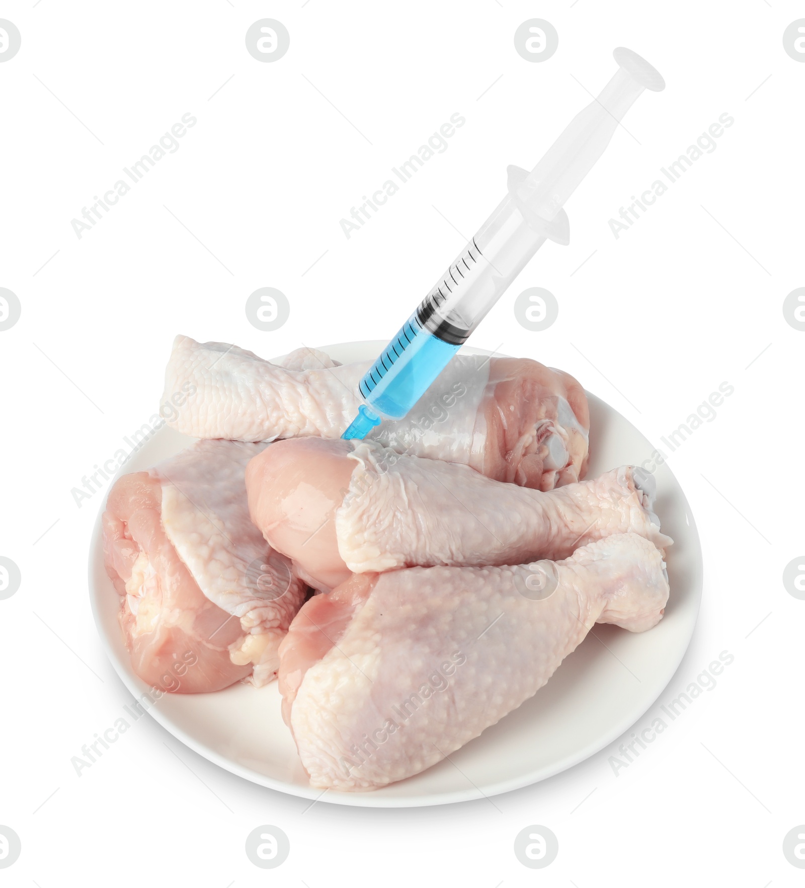 Photo of GMO concept. Chicken drumsticks and syringe isolated on white