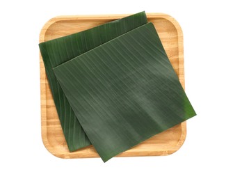 Photo of Pieces of banana leaves isolated on white, top view. Traditional meal serving