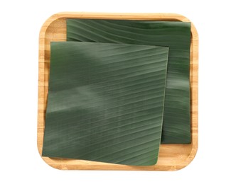 Photo of Pieces of banana leaves isolated on white, top view. Traditional meal serving