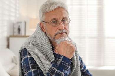 Photo of Sad senior man feeling lonely at home