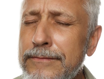 Photo of Sad senior man crying on white background, closeup