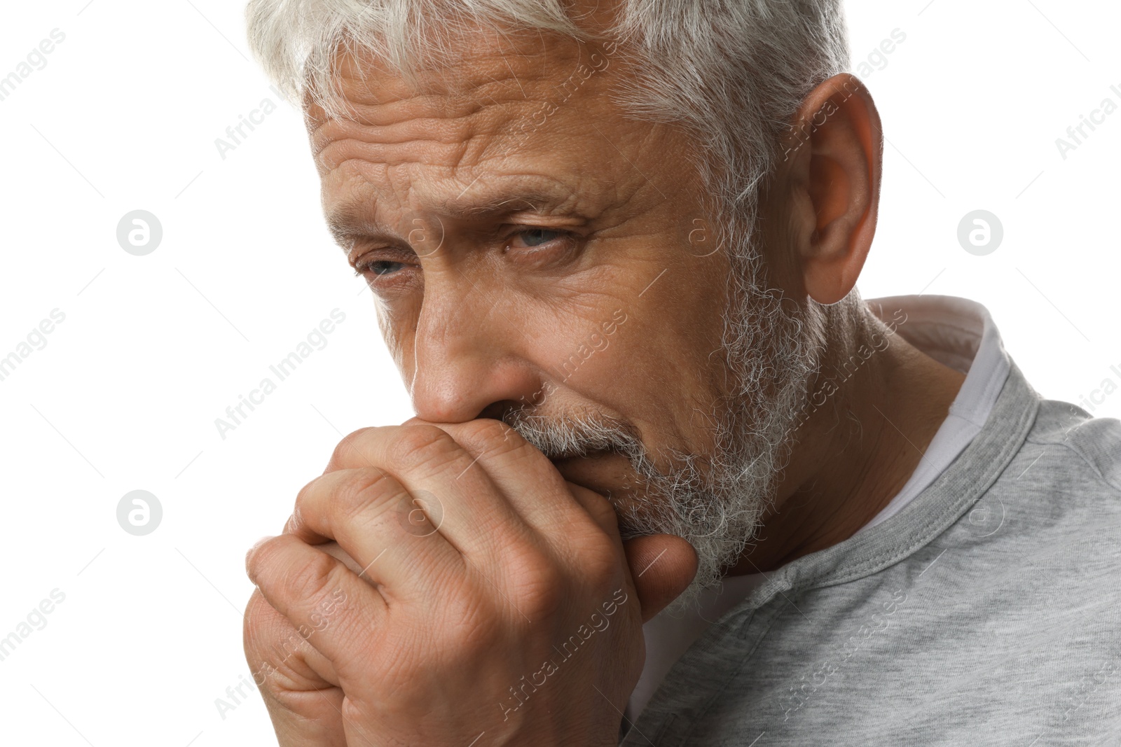 Photo of Sad senior man crying on white background, closeup