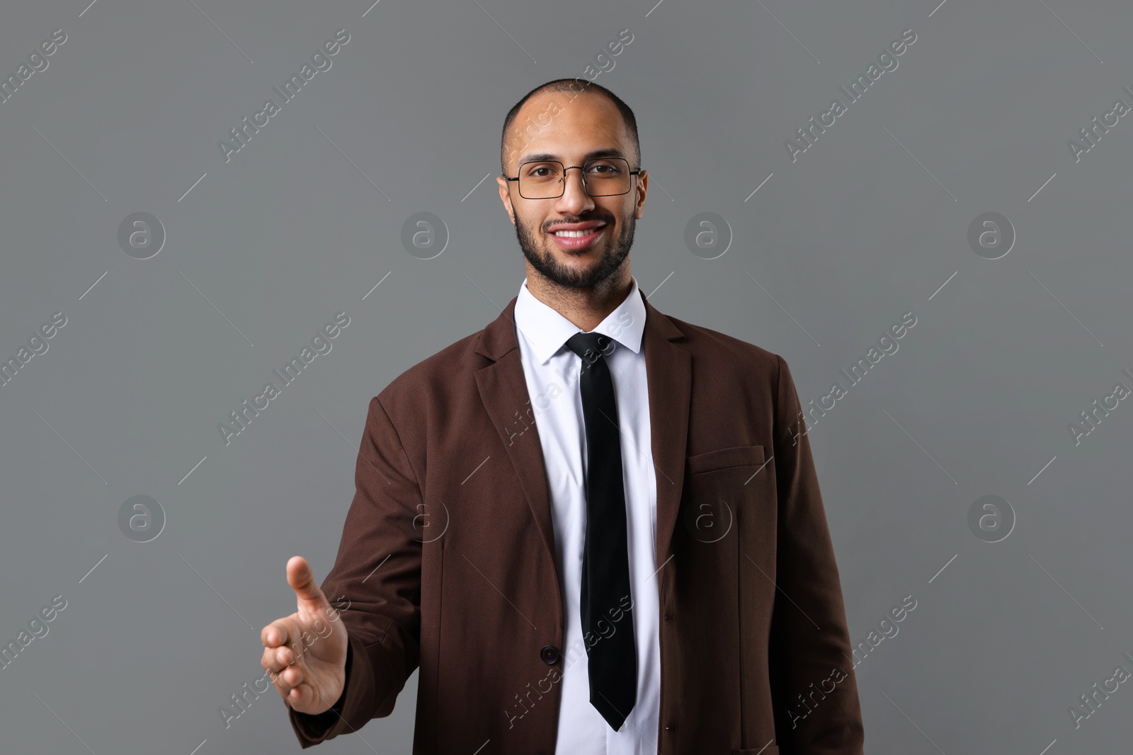 Photo of Portrait of businessman in glasses on gray background