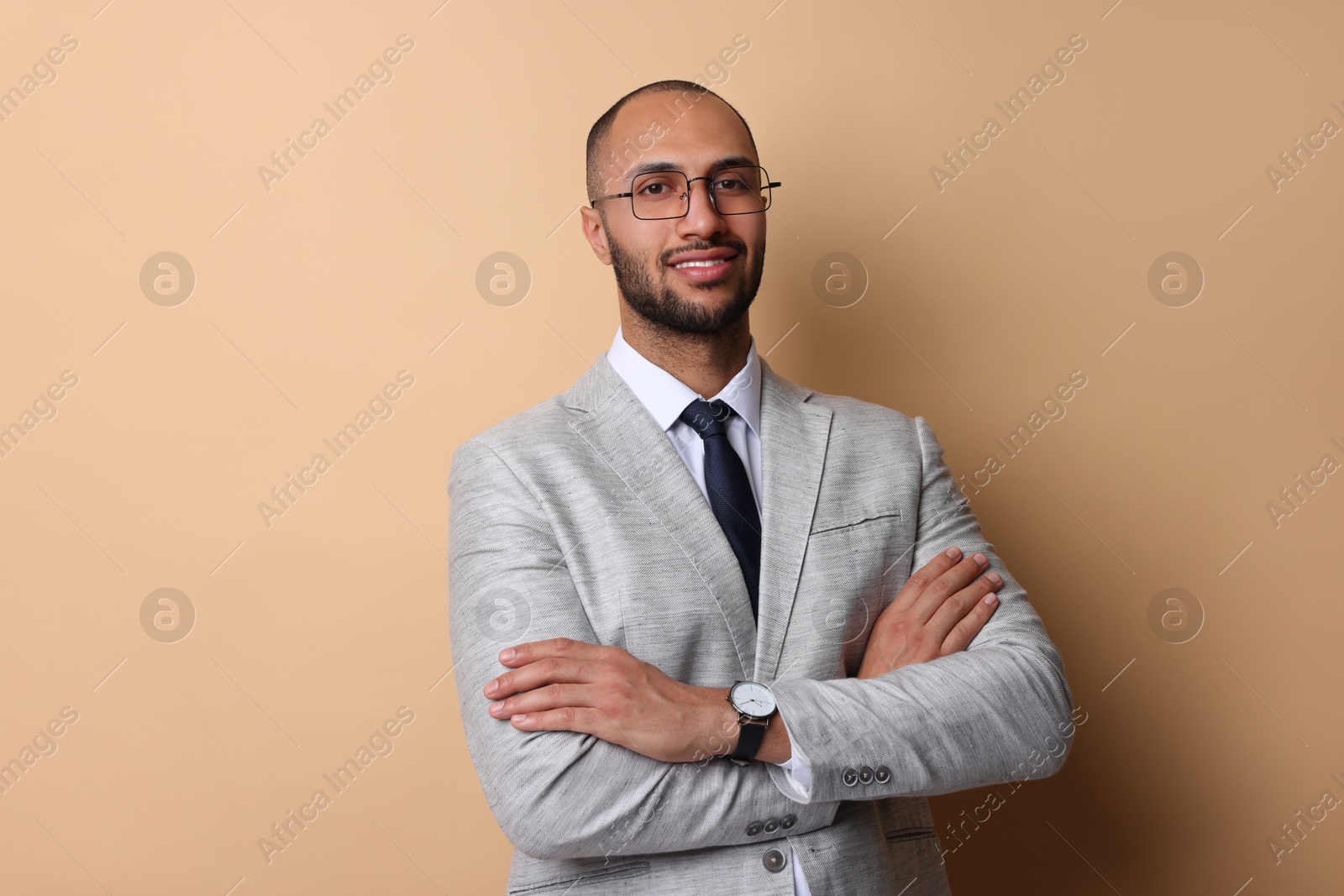 Photo of Portrait of businessman in glasses on beige background