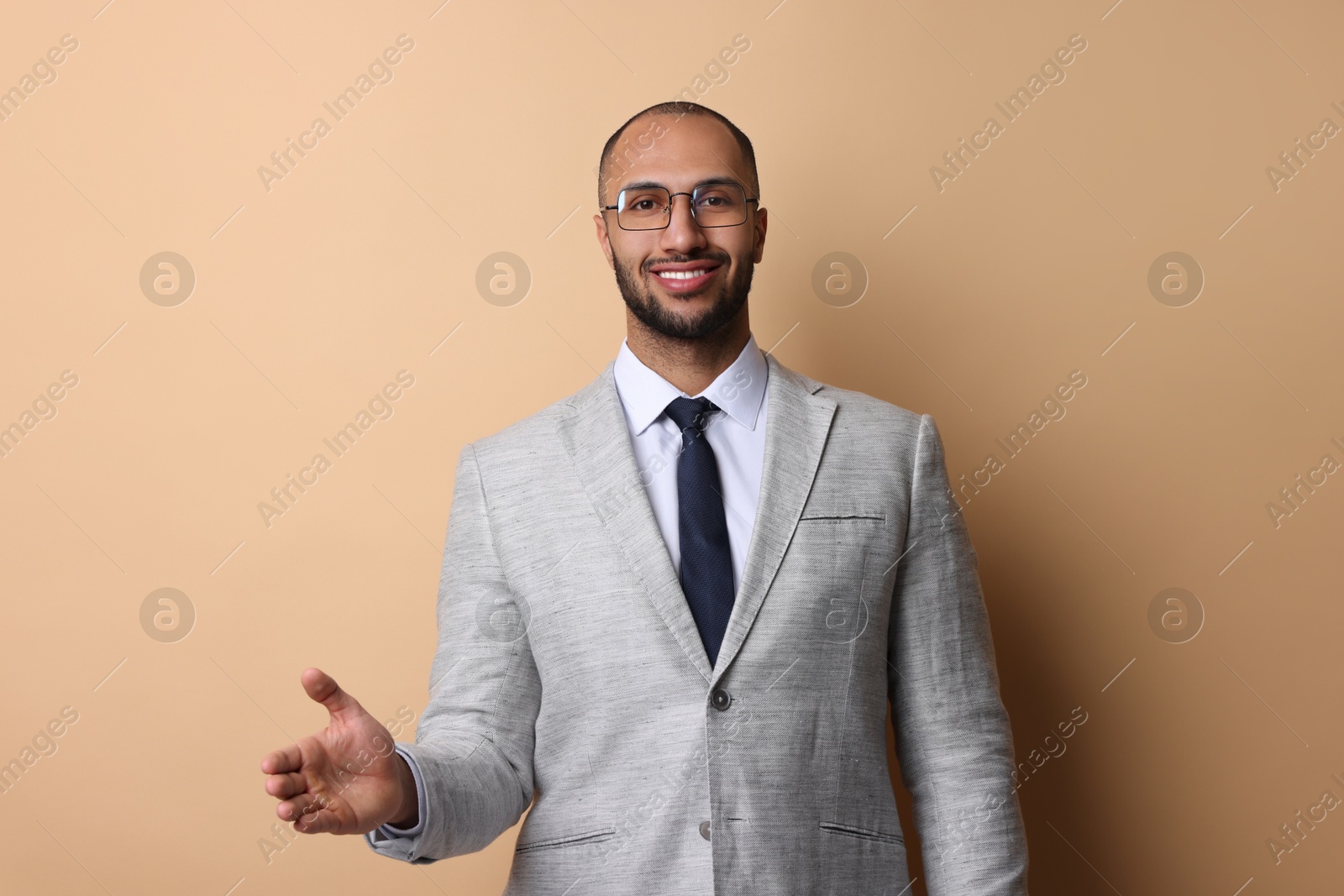 Photo of Portrait of businessman in glasses on beige background